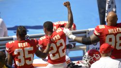 Sep 24, 2017; Carson, CA, USA; Kansas City Chiefs defensive back Marcus Peters (22) protests next to running back Charcandrick West (35) and defensive tackle Roy Miller (98) during the National Anthem prior to the game against the Los Angeles Chargers at StubHub Center. Mandatory Credit: Kelvin Kuo-USA TODAY Sports