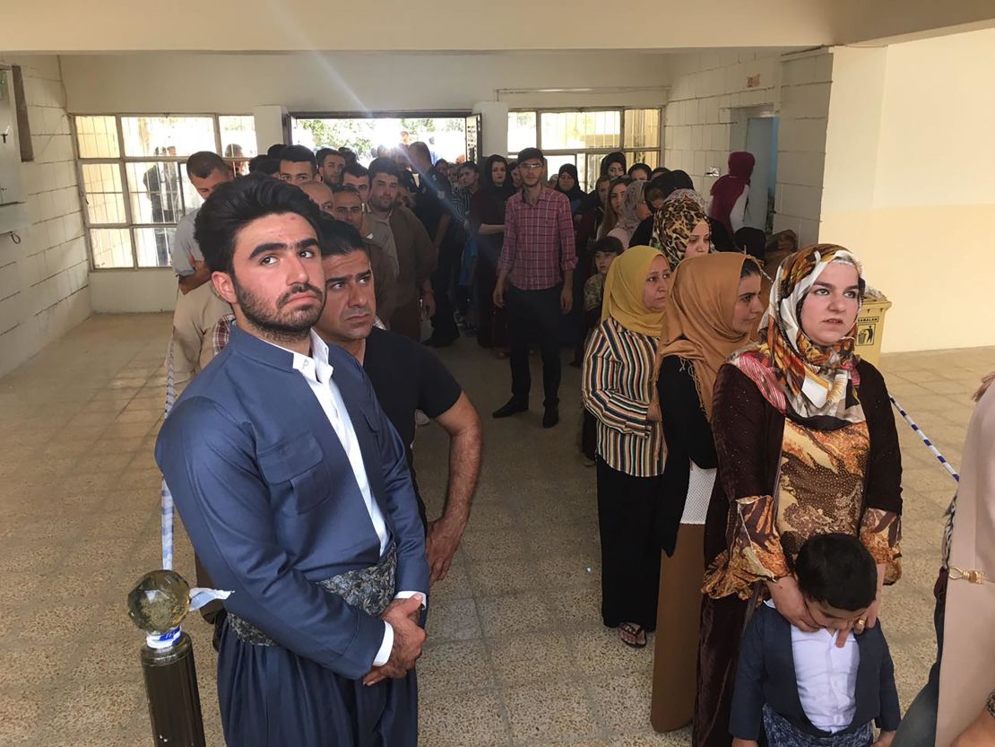 Kurds stand in line to vote at the Azadi neighborhood polling station in Irbil on Monday.