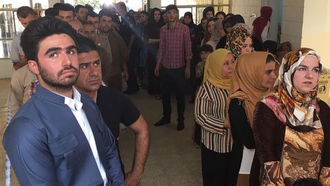 Kurds stand in line to vote at the Azadi neighborhood polling station in Irbil on Monday.
