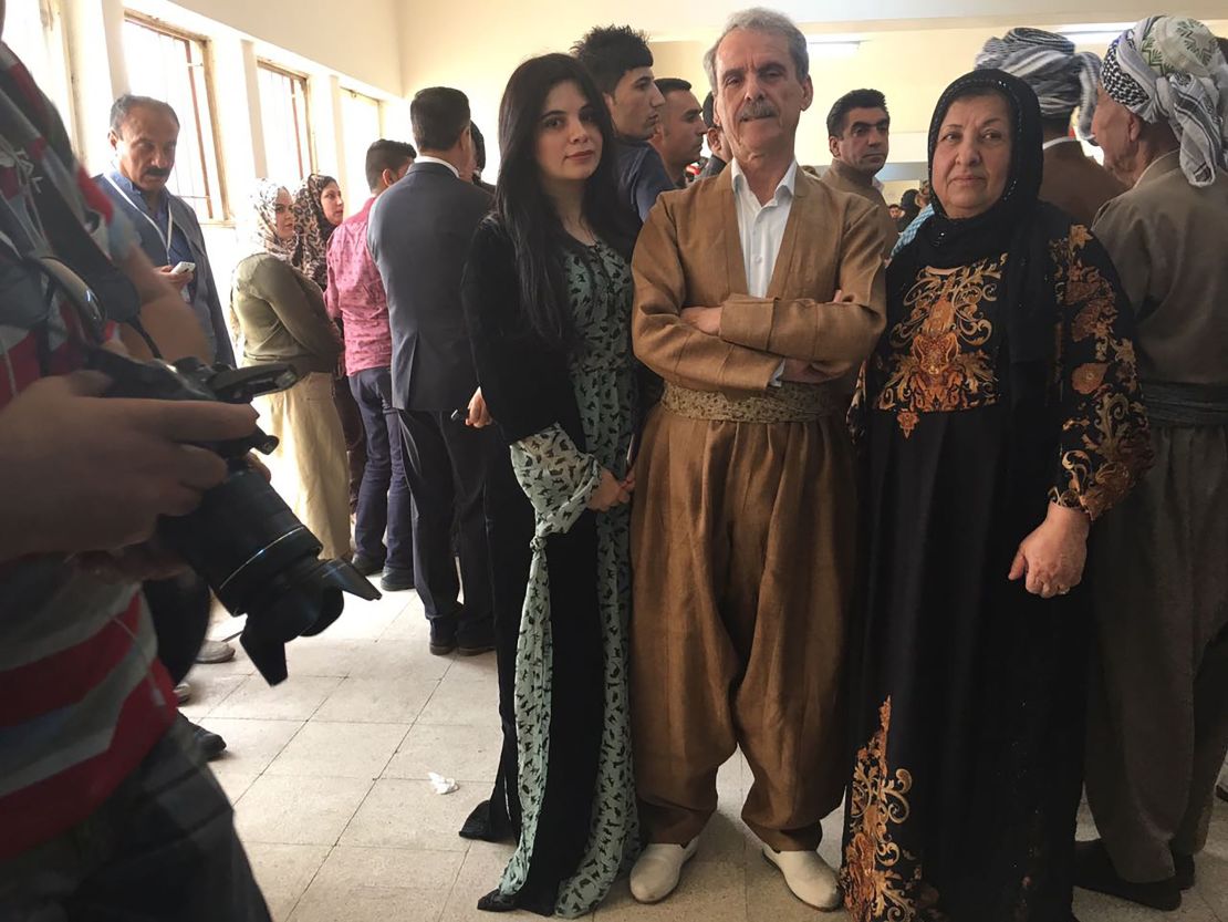 Aso Karim Mohamad, a former MP and ex-Peshmerga fighter, with his wife and daughter at a polling station in Irbil.  