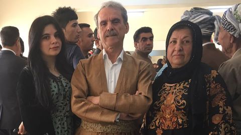 Aso Karim Mohamad, a former MP and ex-Peshmerga fighter, with his wife and daughter at a polling station in Irbil.