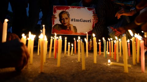 Indian activists take part in a protest rally against the killing of Indian journalist Gauri Lankesh at the India Gate memorial in New Delhi on September 6, 2017.
