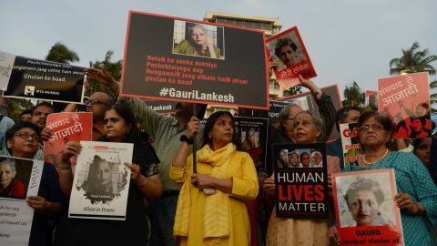 Indian protesters hold placards in a rally condemning the killing of journalist Gauri Lankesh, in Mumbai on September 6, 2017. 
