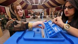 A female members of a Kurdish Peshmerga battalion casts her vote in the Kurdish independence referendum in Arbil, on September 25, 2017. Iraqi Kurds voted in an independence referendum in defiance of Baghdad which has warned of "measures" to defend Iraq's unity and threatened to deprive their region of lifeline oil revenues. / AFP PHOTO / SAFIN HAMED        (Photo credit should read SAFIN HAMED/AFP/Getty Images)
