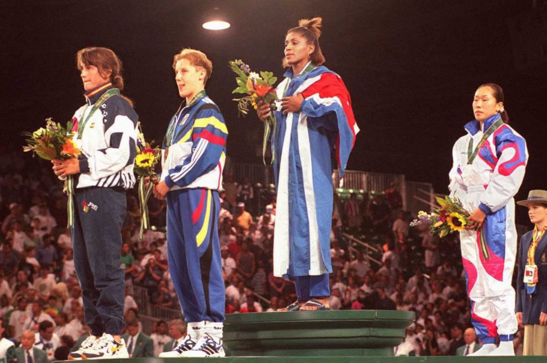 A triumphant Driulis Gonzales stands atop the podium at the Atlanta 1996 Olympics, alongside Spain's Isabel Fernandez, Belgium's Marisabel Lomba and South Korean Jung Sun-Yong.