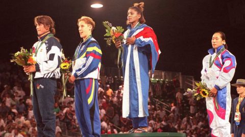 A triumphant Driulis Gonzales stands atop the podium at the Atlanta 1996 Olympics, alongside Spain's Isabel Fernandez, Belgium's Marisabel Lomba and South Korean Jung Sun-Yong.