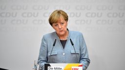 German Chancellor Angela Merkel listens to a question during a press conference at the headquarters of the Christian Democratic Union (CDU) party in Berlin on September 25, 2017, one day after general elections.Merkel woke up to a fourth term but now faces the double headache of an emboldened hard-right opposition party and thorny coalition talks ahead. / AFP PHOTO / Tobias SCHWARZ        (Photo credit should read TOBIAS SCHWARZ/AFP/Getty Images)