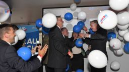 AfD board members celebrate with baloons during the election party of the nationalist 'Alternative for Germany', AfD, in Berlin, Germany, Sunday, Sept. 24, 2017, after the polling stations for the German parliament elections had been closed. (AP Photo/Martin Meissner)