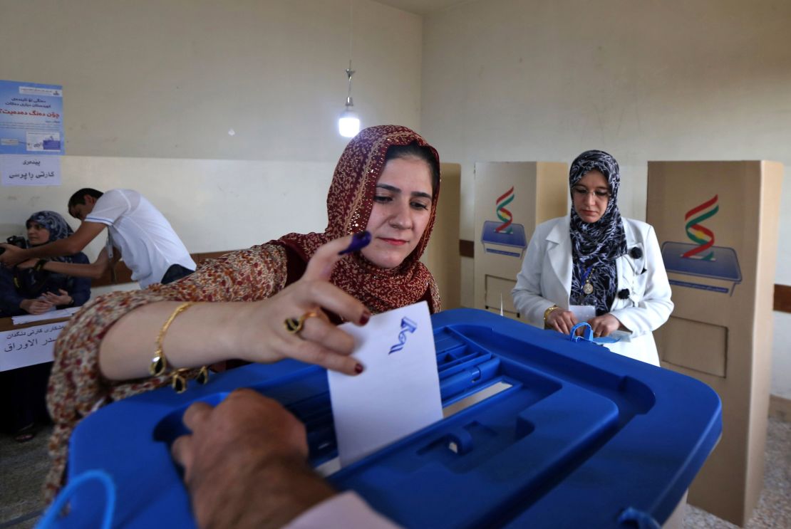 An Iraqi Kurdish woman casts her vote in Irbil on Monday. 