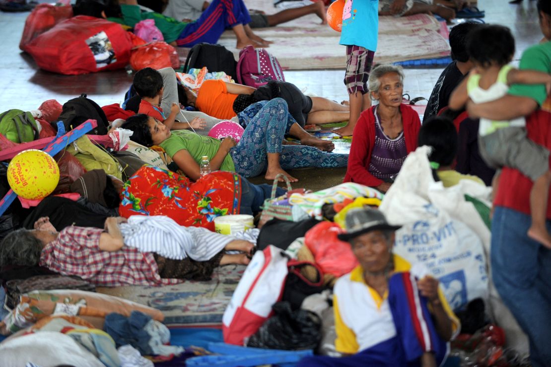 Villagers rest after being evacuated during the raised alert levels for the volcano on Mount Agung on September 22, 2017. 