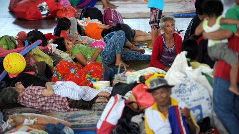 Villagers rest after being evacuated during the raised alert levels for the volcano on Mount Agung in Klungkung regency on the Indonesian resort island of Bali on September 22, 2017. 