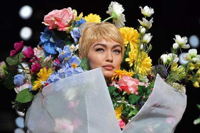 Gigi Hadid styled as a giant bouquet of flowers for the final look during the Moschino show. 