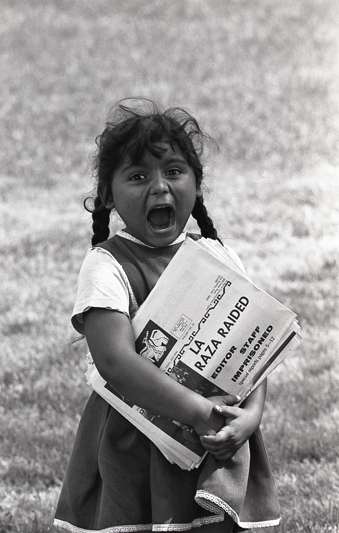 A little girl hands out copies of La Raza at the 1968 Poor People's Campaign for economic justice in Washington.