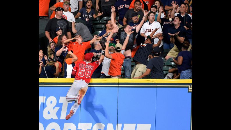 Los Angeles Angels right fielder Kole Calhoun watches fans catch a George Springer home run during a Major League Baseball game in Houston on Sunday, September 24.
