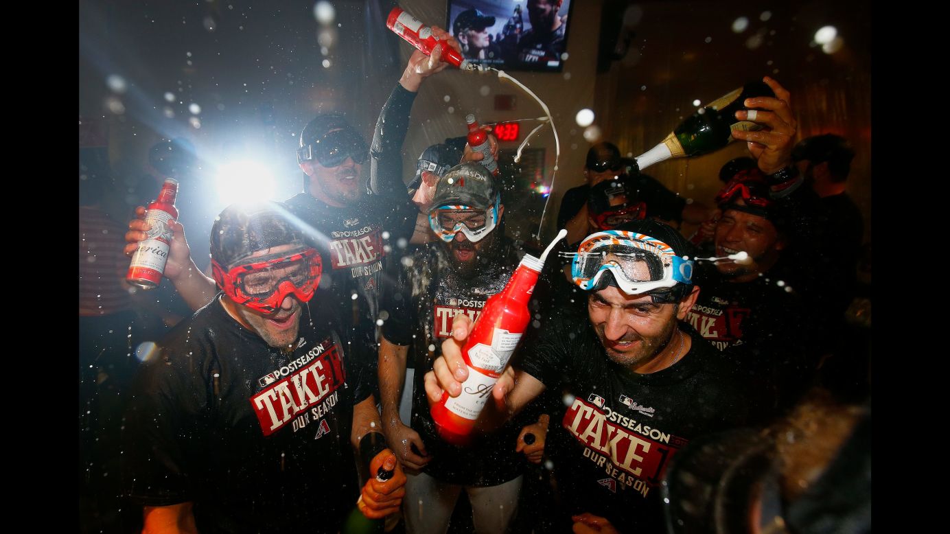 The Arizona Diamondbacks celebrate in the locker room Sunday, September 24, after a 3-2 victory over Miami clinched a spot in the playoffs. They will host the National League Wild Card game on October 4.
