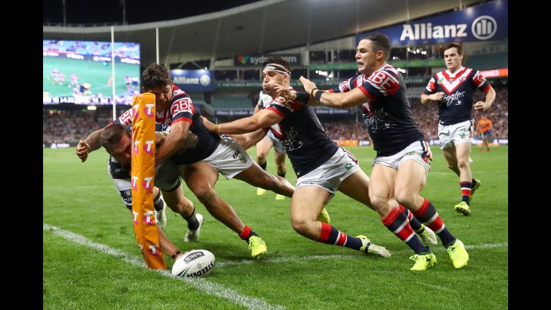Kyle Feldt scores for North Queensland as he's tackled during a preliminary final of Australia's National Rugby League on Saturday, September 23. North Queensland defeated Sydney 29-16 for a spot in the league's grand final against Melbourne.