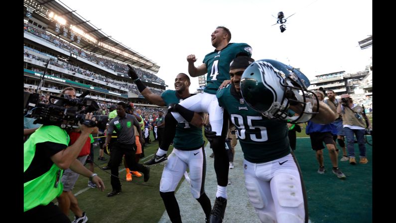 Philadelphia kicker Jake Elliott is carried off the field after <a href="index.php?page=&url=http%3A%2F%2Fbleacherreport.com%2Farticles%2F2734908-jake-elliott-drills-61-yarder-in-last-second-as-eagles-stun-eli-manning-giants" target="_blank" target="_blank">his 61-yard field goal</a> defeated the New York Giants on Sunday, September 24. It was the longest kick in team history.