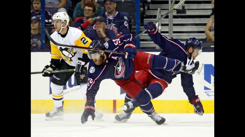 Columbus defenseman David Savard, center, collides with teammate John Mitchell during an NHL preseason game on Friday, September 22. The regular season begins on October 4.