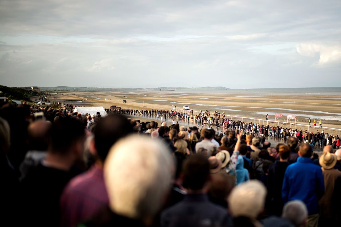 More than 5000 regular visitors watch the horse racing on the temporary track at Laytown.
