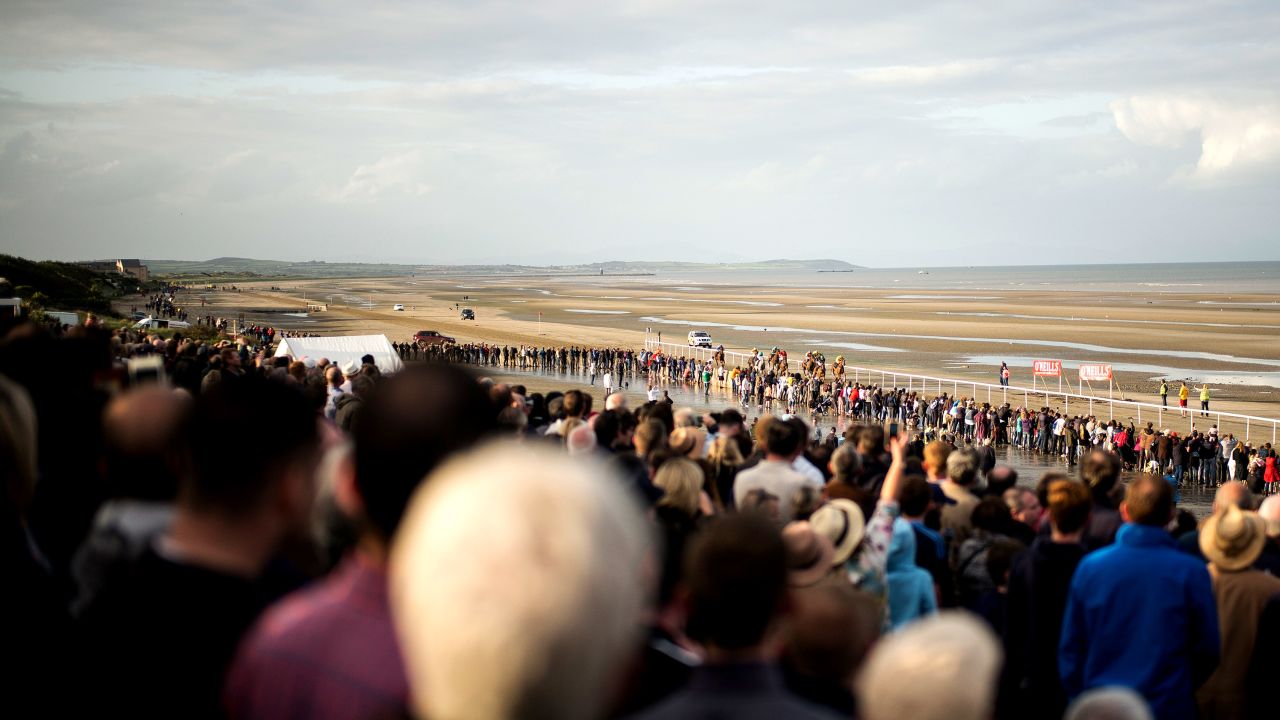 More than 5000 regular visitors watch the horse racing on the temporary track at Laytown.