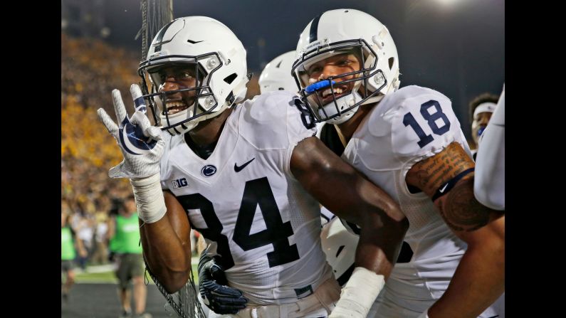 Penn State wide receiver Juwan Johnson, left, is congratulated by teammate Jonathan Holland after catching the game-winning touchdown pass at Iowa on Saturday, September 23. The touchdown came on <a href="index.php?page=&url=http%3A%2F%2Fbleacherreport.com%2Farticles%2F2734807-penn-state-beats-iowa-on-final-play-behind-saquon-barkleys-huge-performance" target="_blank" target="_blank">the final play of the game.</a>