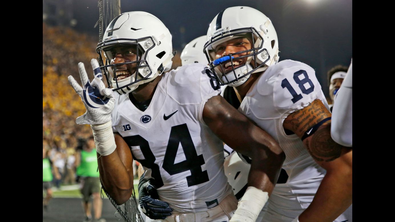 Penn State wide receiver Juwan Johnson, left, is congratulated by teammate Jonathan Holland after catching the game-winning touchdown pass at Iowa on Saturday, September 23. The touchdown came on <a href="http://bleacherreport.com/articles/2734807-penn-state-beats-iowa-on-final-play-behind-saquon-barkleys-huge-performance" target="_blank" target="_blank">the final play of the game.</a>