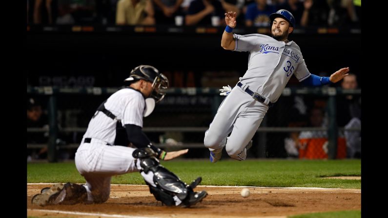 Kansas City's Eric Hosmer slides safely into home plate during a game in Chicago on Saturday, September 23.