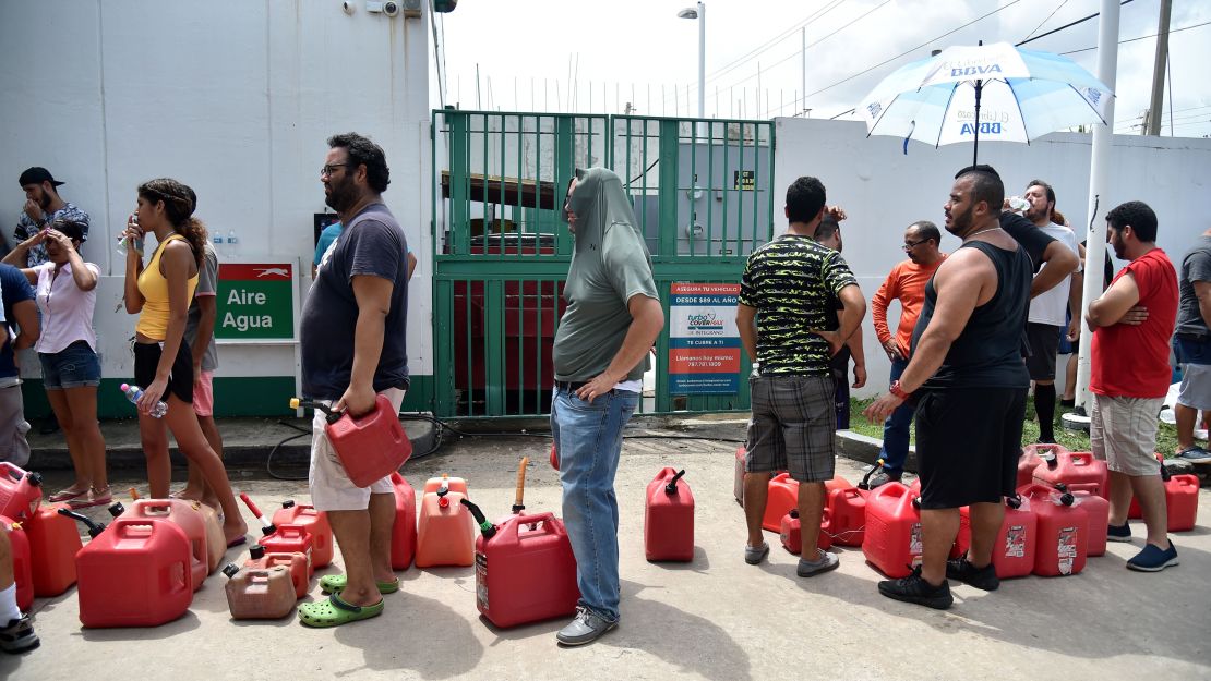 People wait in line to buy gas in Bayamón, Puerto Rico.