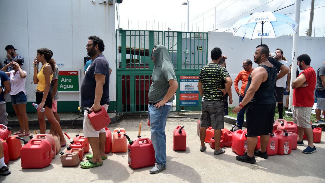 People wait in line to buy gas in Bayamón, Puerto Rico. 