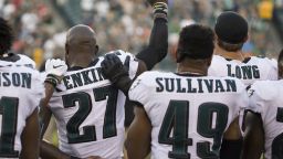 PHILADELPHIA, PA - AUGUST 24: Malcolm Jenkins #27 of the Philadelphia Eagles holds his fist in the air while Tre Sullivan #49 stands behind him and Chris Long #56 puts his arm on his shoulder during the national anthem prior to the preseason game against the Miami Dolphins at Lincoln Financial Field on August 24, 2017 in Philadelphia, Pennsylvania. (Photo by Mitchell Leff/Getty Images)