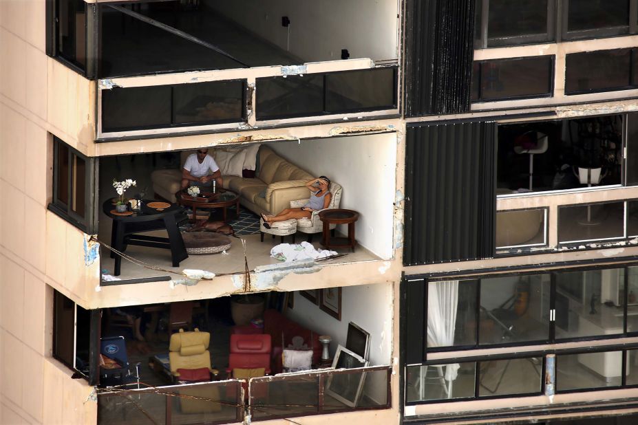 An apartment building is missing a wall in San Juan, Puerto Rico, on Monday, September 25, nearly a week after Hurricane Maria devastated the US commonwealth. Power is still out in most places, and communications remain almost nonexistent on the island of 3.4 million people. 