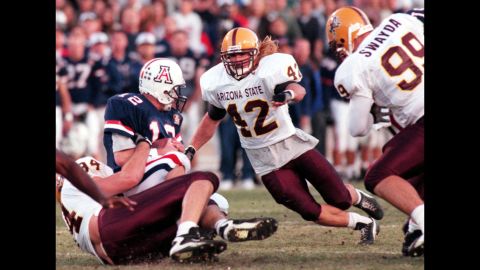 Arizona State's Pat Tillman  assists on a tackle during a November 1996 game against in-state rival Arizona.