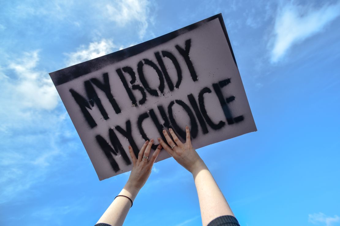 A protester holds a "My Body My Choice'" sign during the Strike 4 Repeal demonstration in Dublin in March.