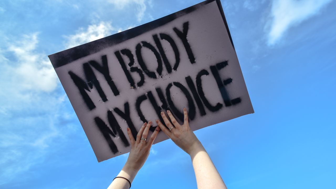 A protester holds a "My Body My Choice'" sign during the Strike 4 Repeal demonstration in Dublin in March. 