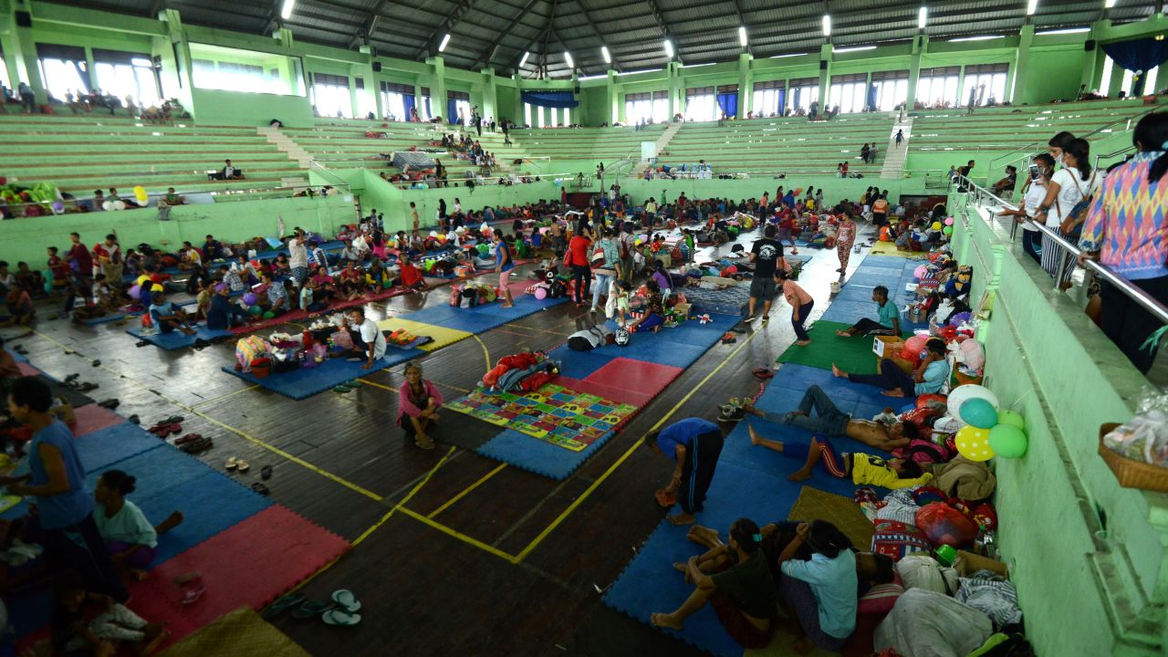 Evacuees wait on September 25, inside an evacuation center in Klungkung regency, on the Indonesian resort island of Bali.