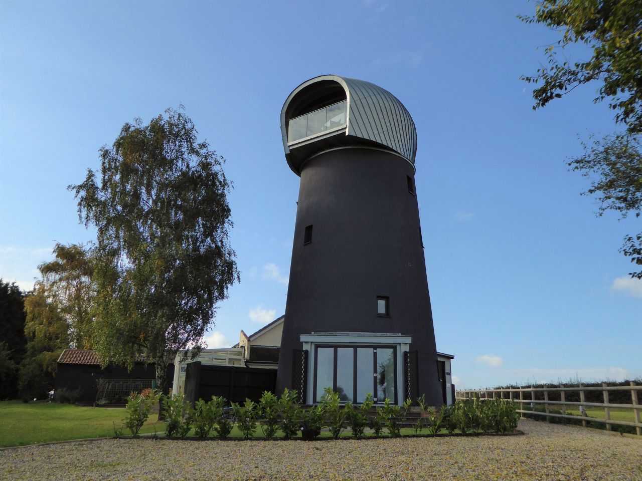 This 125-year-old disused windmill in Suffolk UK was transformed into a luxury guest house by Beech Architects. 