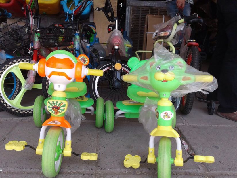 Children's bikes are displayed in a toy store in Mosul. Many toy shops were forced to close or were banned from selling items that resembled humans or animals.