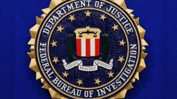 The Federal Bureau of Investigation (FBI) seal is seen on the lectern following a press conference announcing the FBI's 499th and 500th additions to the "Ten Most Wanted Fugitives" list on June 17, 2013 at the Newseum in Washington, DC. (MANDEL NGAN/AFP/Getty Images)
