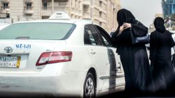 A Saudi woman prepares to get into a taxi on a main street in the Saudi coastal city of Jeddah on September 27, 2017.Saudi Arabia will allow women to drive from next June, state media said on September 26, 2017 in a historic decision that makes the Gulf kingdom the last country in the world to permit women behind the wheel. The shock announcement comes after a years-long resistance from women's rights activists, some of whom were jailed for defying the ban on female driving. / AFP PHOTO / AMER HILABI        (Photo credit should read AMER HILABI/AFP/Getty Images)