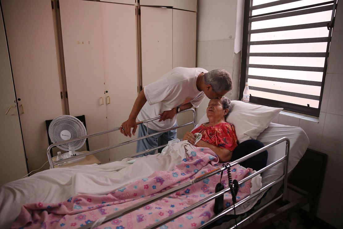 Rafael Robles-Ortiz kisses his mother Josefina Ortiz, staying at an elderly care facility in San Juan, Puerto Rico. Mr. Robles-Ortiz was concerned for his mother, hoping aid and supplies would get through to the facility after Hurricane Maria.