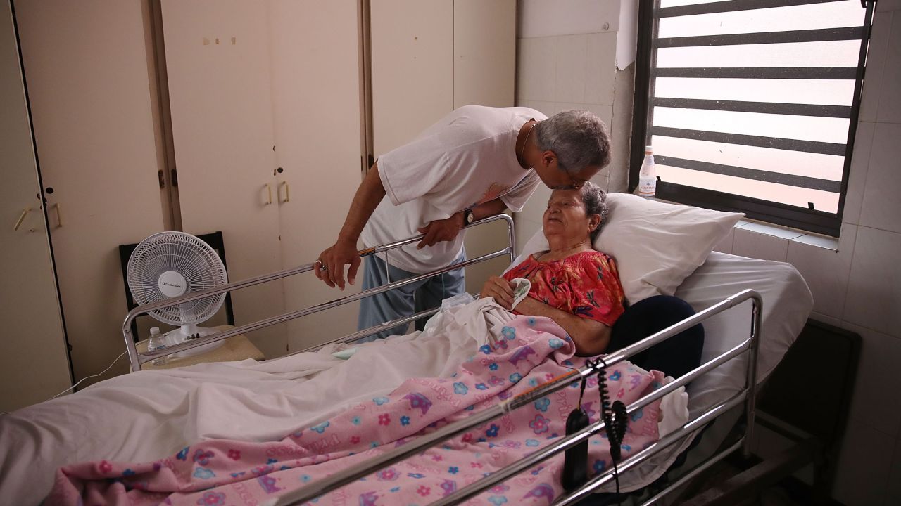 Rafael Robles-Ortiz kisses his mother Josefina Ortiz, staying at an elderly care facility in San Juan, Puerto Rico. Mr. Robles-Ortiz was concerned for his mother, hoping aid and supplies would get through to the facility after Hurricane Maria.