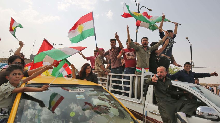 Iraqis Kurds celebrate with the Kurdish flag in the streets of the northern city of Kirkuk on September 25, 2017 as they vote in a referendum on independence.The non-binding vote, initiated by veteran Kurdish leader Massud Barzani, has angered not only Baghdad, following which Iraq's federal parliament demanded that troops be sent to disputed areas in the north controlled by the Kurds since 2003, but also neighbours Turkey and Iran who are concerned it could stoke separatist aspirations among their own sizeable Kurdish minorities. / AFP PHOTO / AHMAD AL-RUBAYE        (Photo credit should read AHMAD AL-RUBAYE/AFP/Getty Images)