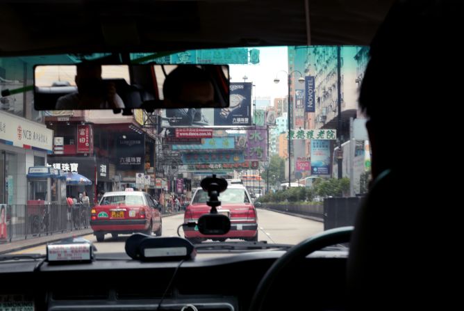 <strong>Grandpa's photos -- Nathan Rd, Hong Kong -- present day: </strong>For maximum authenticity, Tomkins even used the same camera Clarke used in the 1960s -- a Voigtlander Bessamatic.