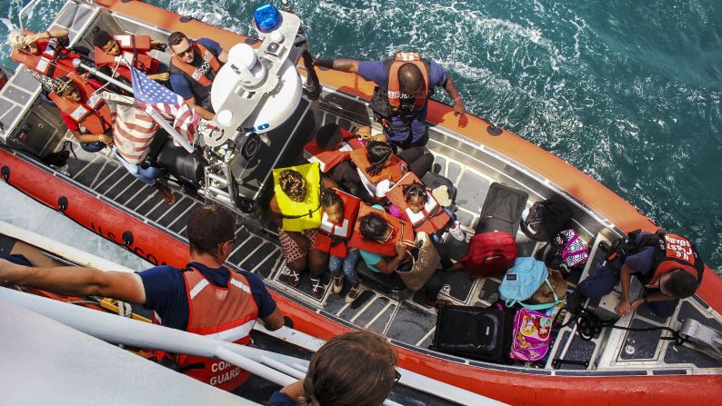 The US Coast Guard transports people off the Caribbean island of St. Thomas during Hurricane Irma relief efforts on Tuesday, September 12.