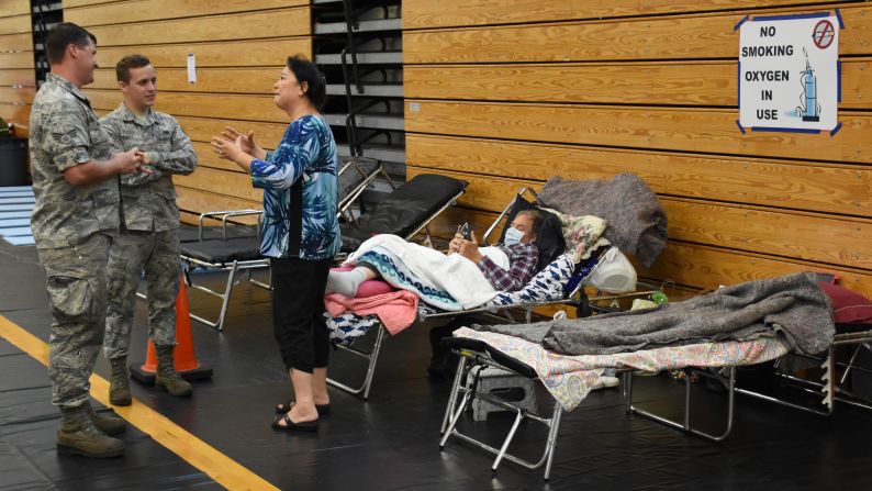 Members of the Florida Air National Guard help people at a Jacksonville high school that served as a shelter during Hurricane Irma on Saturday, September 9.