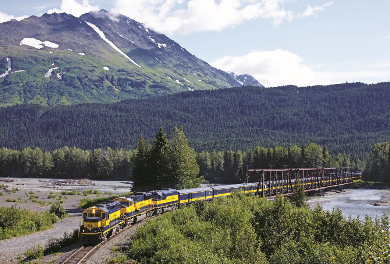 The Western railroads weave through spectacular scenery, such as Snow River, Alaska. 