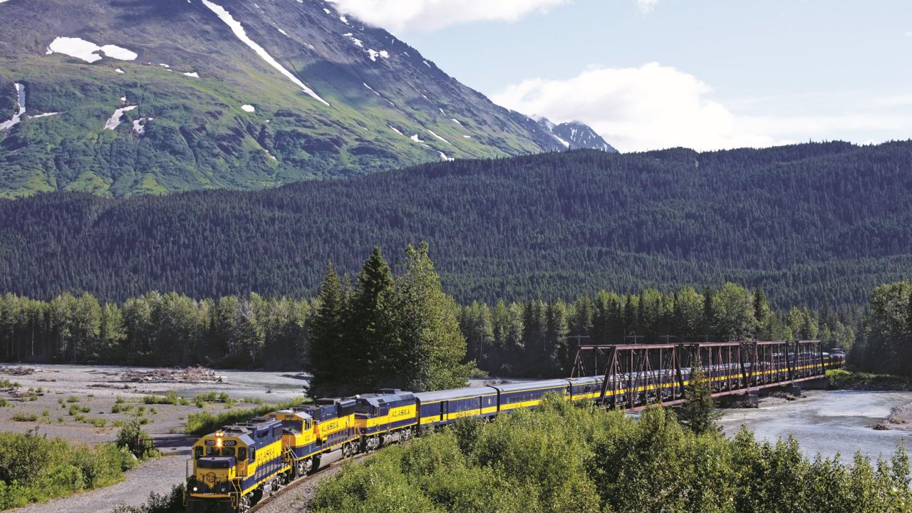 The Western railroads weave through spectacular scenery, such as Snow River, Alaska. 