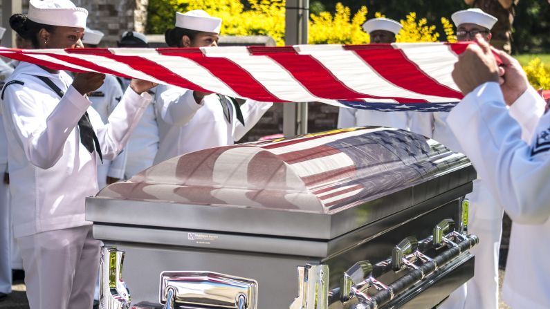 Sailors drape a flag over the casket of Petty Officer 1st Class Charles Casto during a repatriation ceremony in Honolulu on Thursday, September 14. Casto was aboard the USS Oklahoma during the attack on Pearl Harbor, and his remains were recently identified. He was buried alongside his brother, Richard, who was also aboard the Oklahoma.