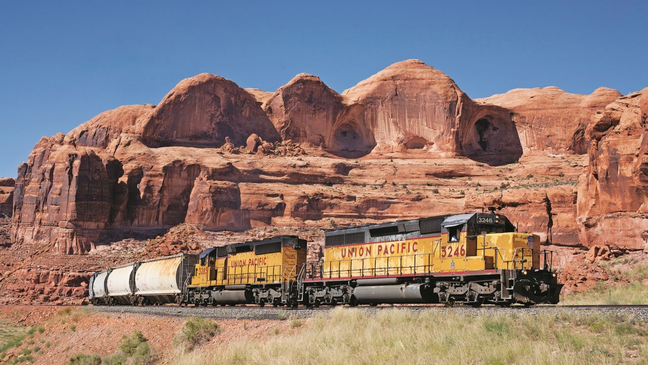A Union Pacific train passes Utah's dramatic red rock formations.  