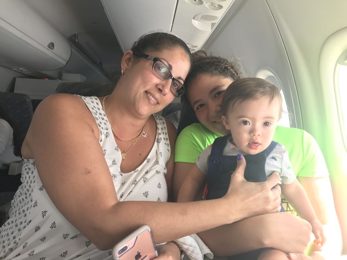 Lydia Acevedo, her year-old grandson Mateo and her daughter
Nayelys aboard the evacuation flight.